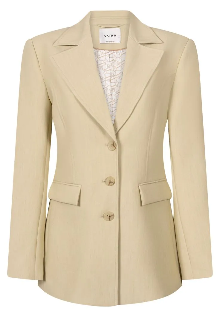 Women's formal blazer detail showing premium stitching